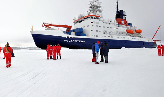 Jill McDermott next to the Polarstern in the Arctic
