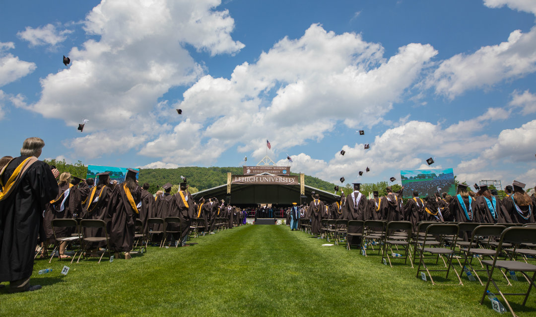 Lehigh graduates toss their caps in the air at commencement 