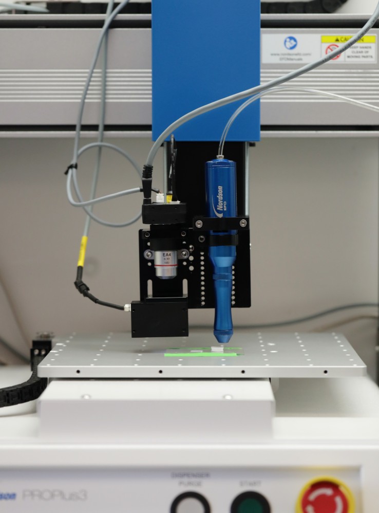 Solvent-cast 3D printer printing a biodegradable polymer-based scaffold in Lehigh  professor Lesley Chow's lab