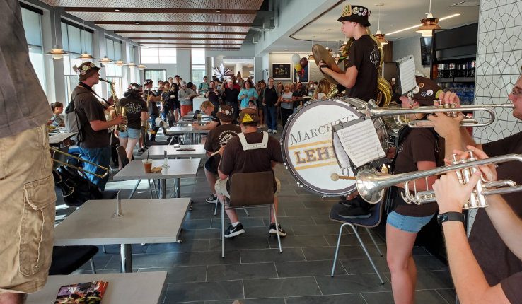 The Marching 97 plays inside the new Cafe at FML.