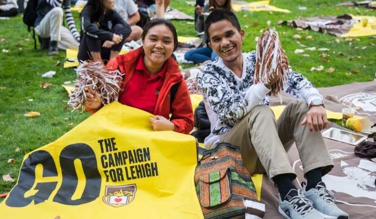 Students sit on blanket at Lehigh University's Brown & White BBQ