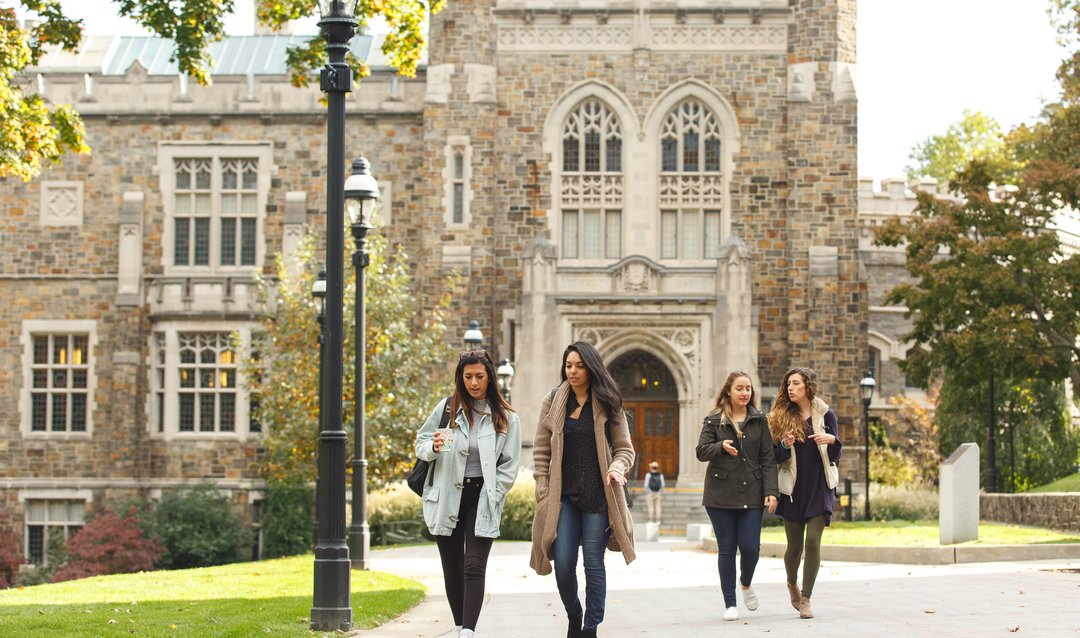 Female Students walk on campus