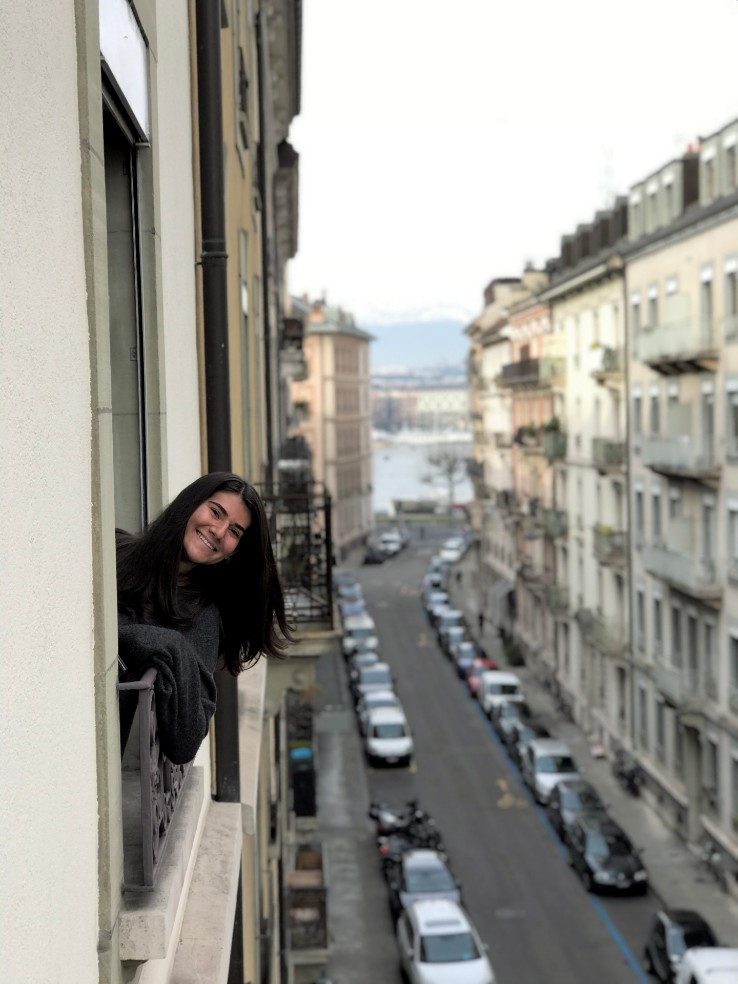 Samantha Margolis in her apartment window in Geneva