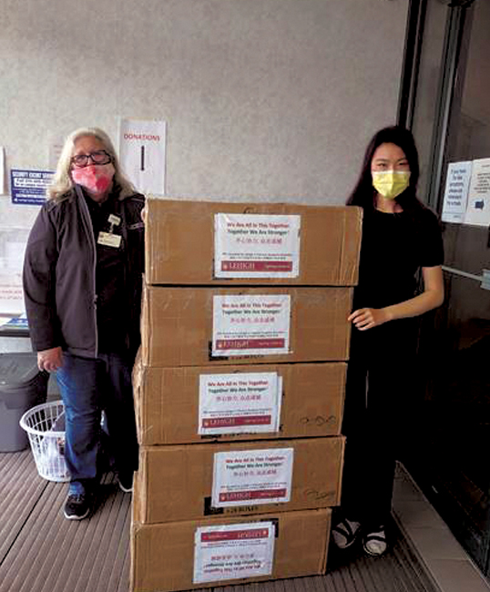Elizabeth Cao ’21 (right) drops off masks at Lehigh Valley Health Network.