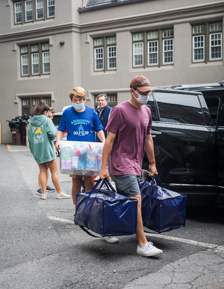 Chris Krein '25 carries his belongings