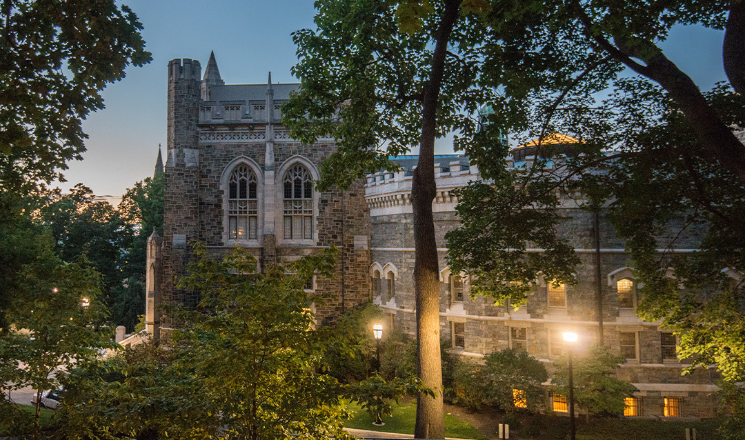 Lehigh University's campus at dusk with Linderman Library in background and lights in foreground