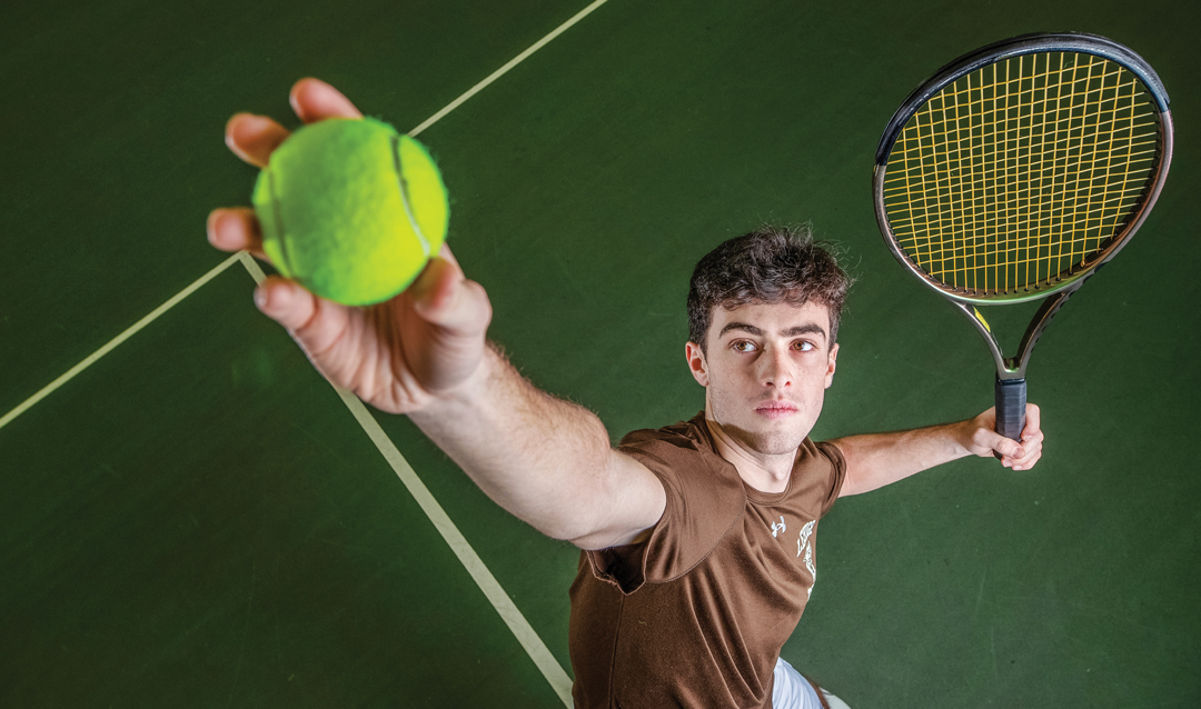 Marc Blekhman ’25 serving a tennis ball