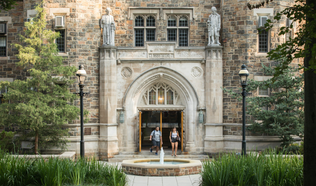 Students walk outside of Lehigh University's Packard Lab