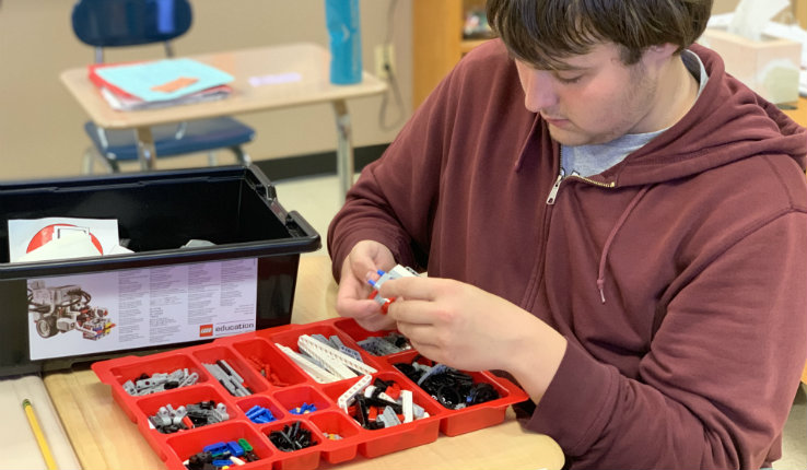 A student from the Centennial School organizes an EV3 robotics kit