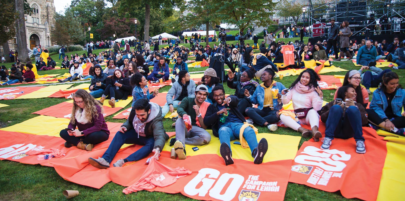 Students sitting on blankets on the University Center lawn