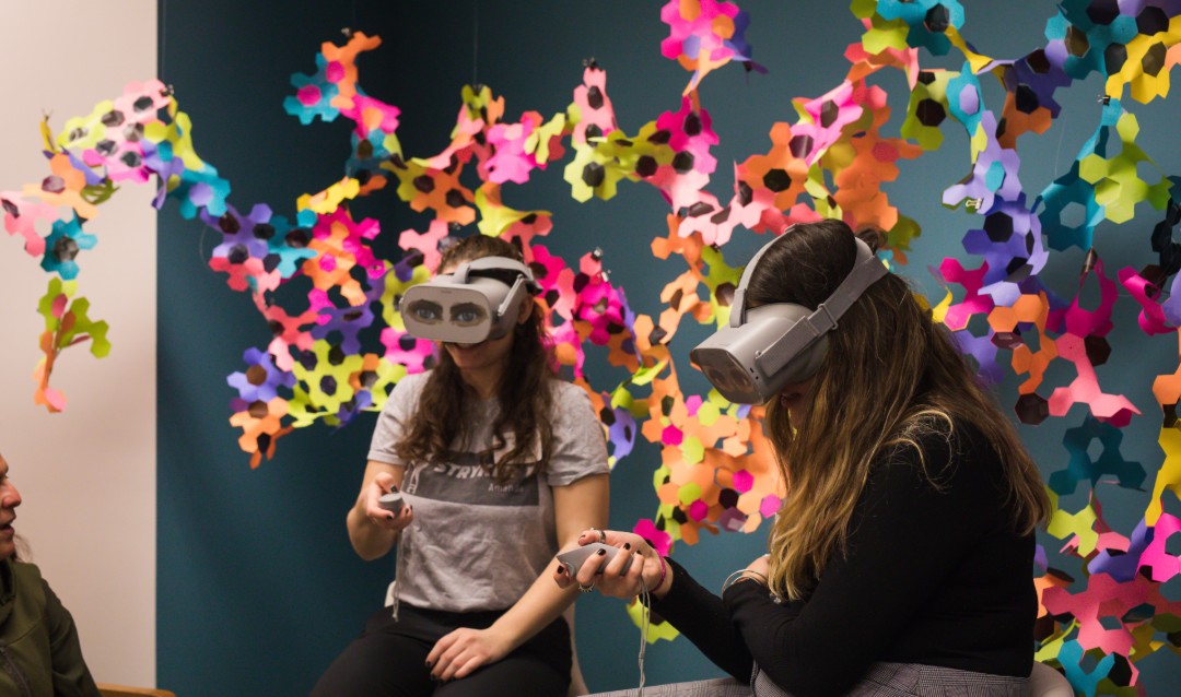 Two female Lehigh students wear VR goggles at CREATIVATE event