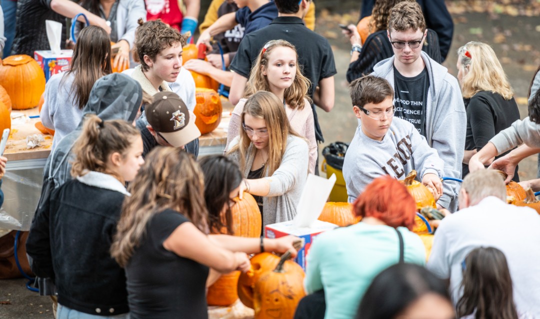Students and families carve pumpkins at pumpkins and power tools event at Lehigh University