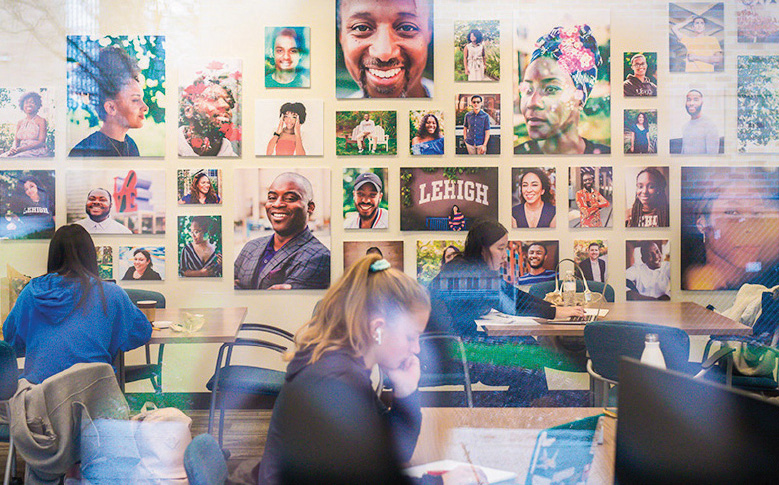 Gallery of Umoja resident photos hanging on a wall