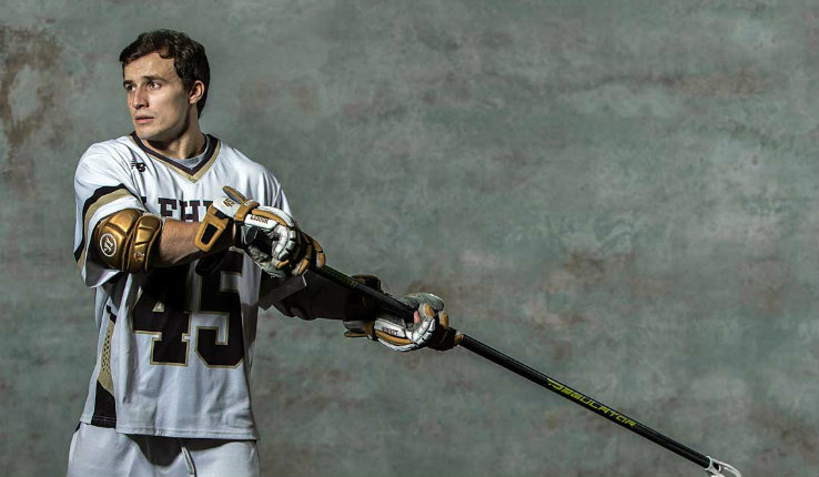 Teddy Leggett posed in a shooting stance with his lacrosse stick