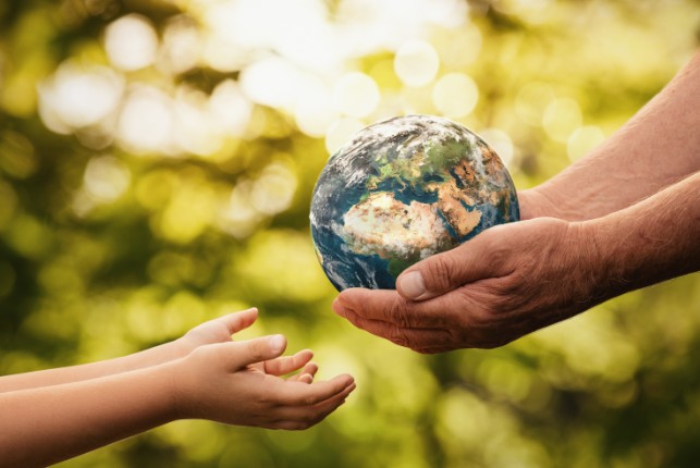 stock image of a person holding a globe