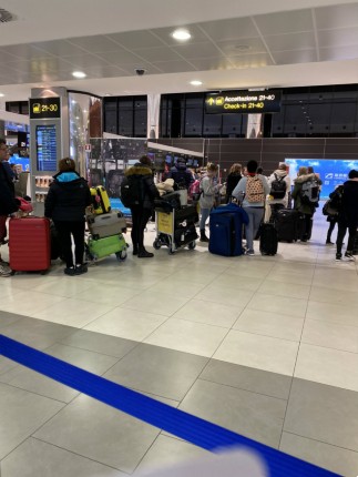 A line of people at Florence's airport