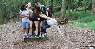  Lehigh Women Engineers PreLUsion participants engage in Lehigh's ropes course.