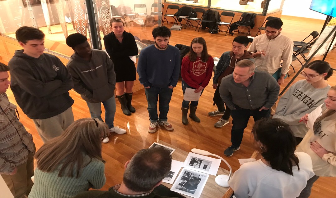 Lehigh students analyzing photographs in spring 2020 as they co-curate the upcoming exhibition Doing Democracy: Photography from the George Stephanopoulos Collection.