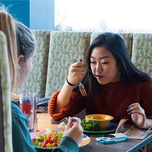 Student eating in a dining hall