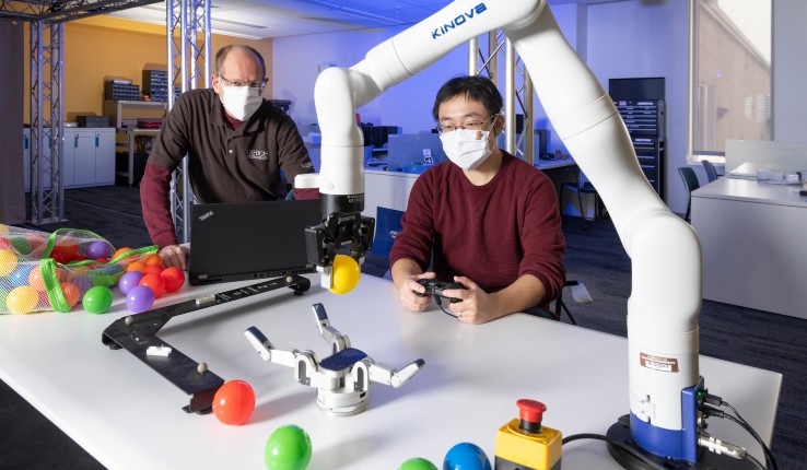 Jinda Cui and his advisor Jeff Tinkle train robots to perform object manipulation tasks.