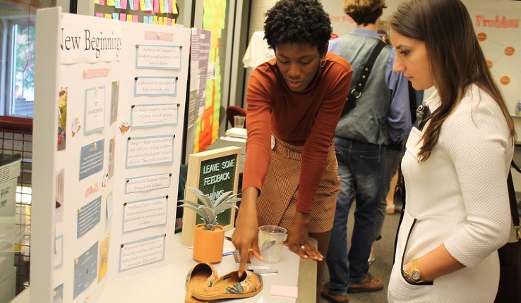 Nikita Morrison '20 presents her project to a student