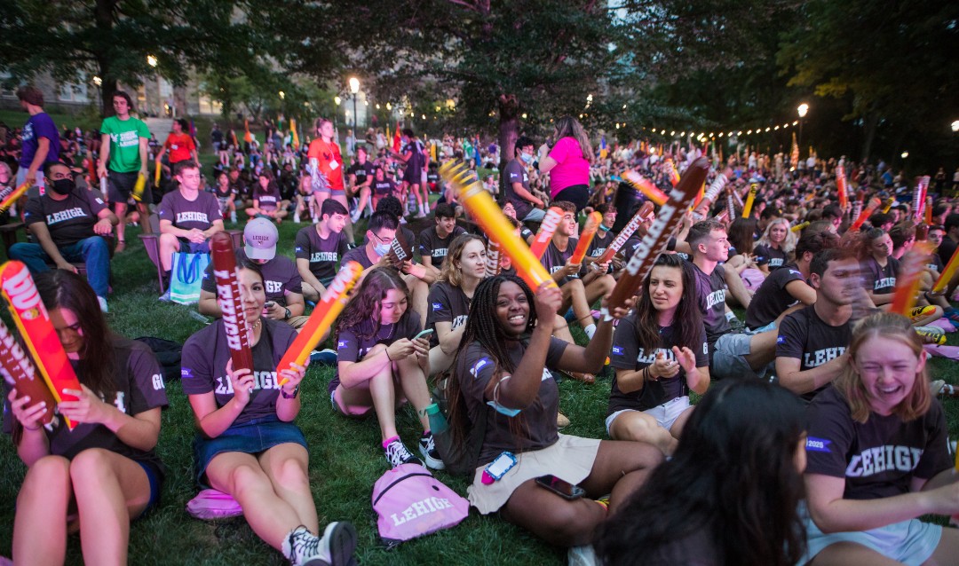 Students sit on the University Center lawn at the Rally