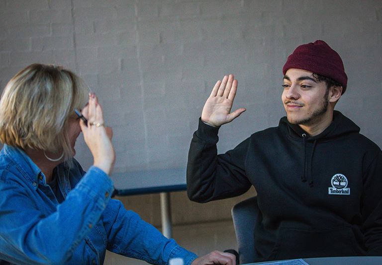 student giving a high five