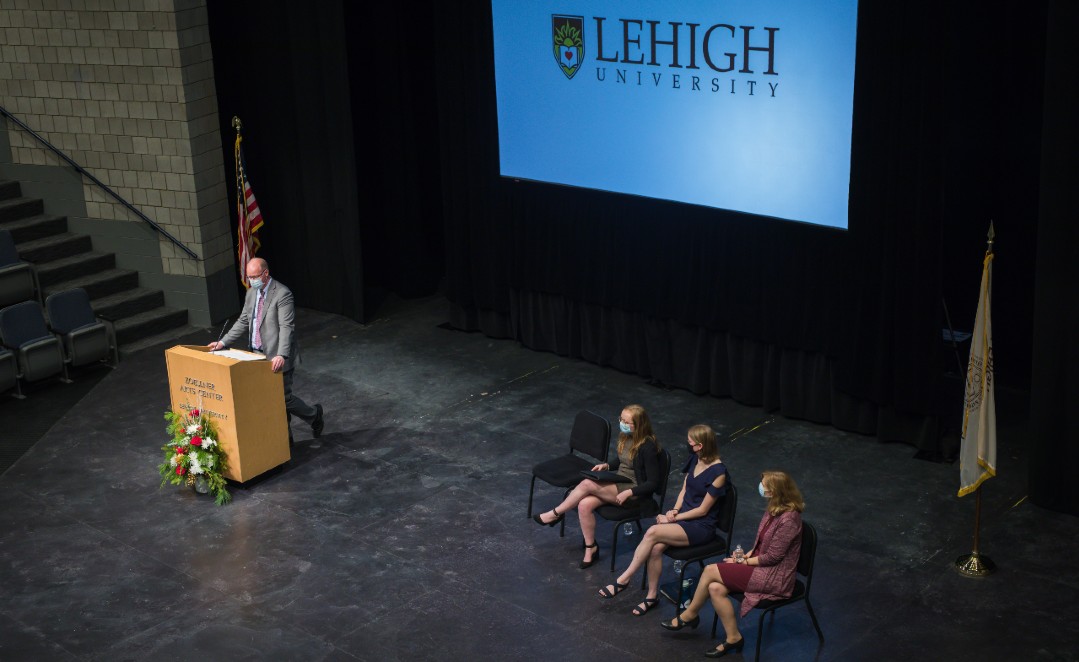 Provost Urban speaks at Lehigh University Honors Convocation, on stage in front of screen