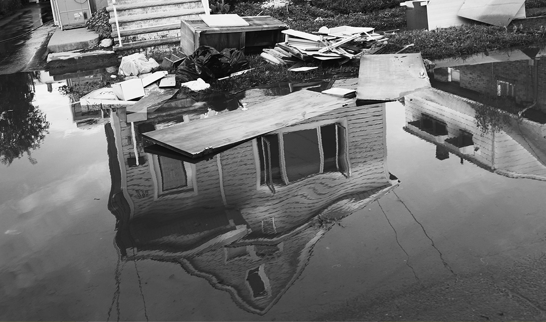A house submerged in floodwaters following a hurricane