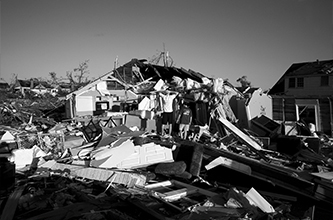 People survey the damage following a tornado