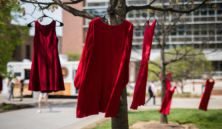 Red dresses hang in trees on Lehigh campus 