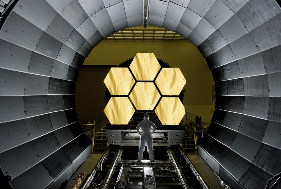 NASA engineer Ernie Wright looks at the James Webb Space Telescope