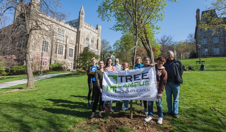Students pose with newly planted tree