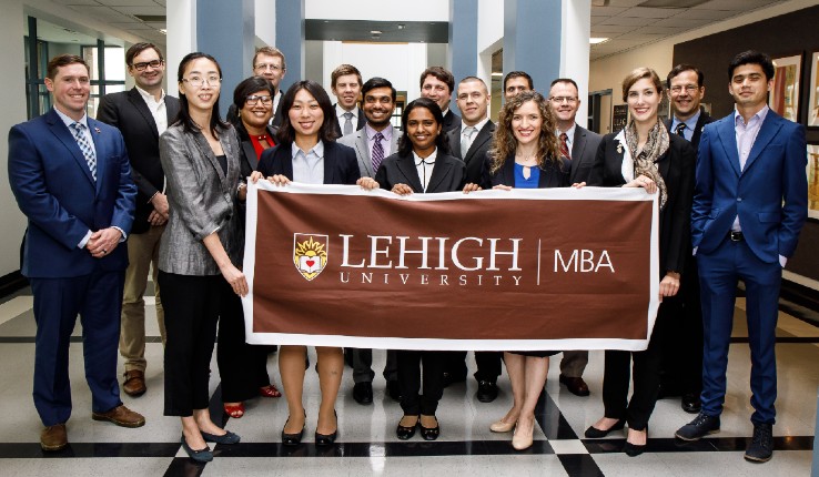 MBA students with Lehigh sign