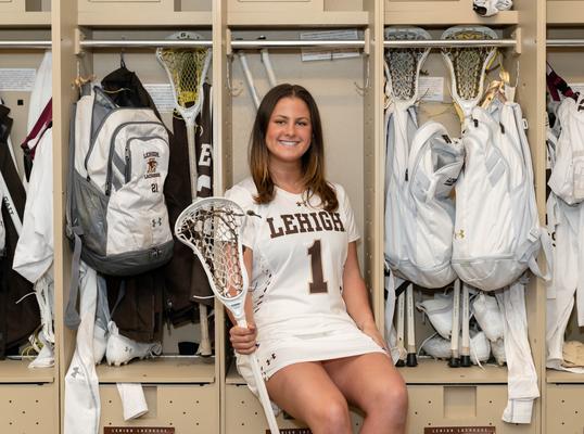 Gabby Schneider posing in locker room
