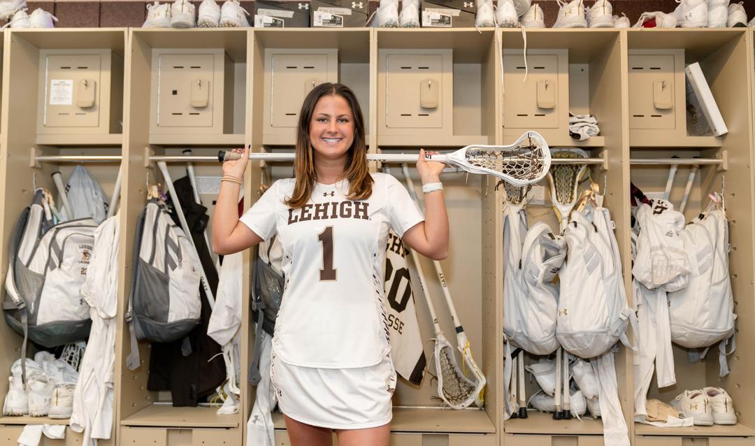 Gabby Schneider poses with lacrosse stick