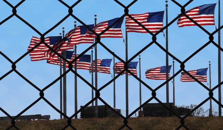 flags behind a fence