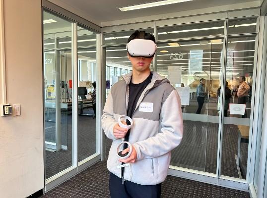 Dennis Lam '23 wearing VR headset