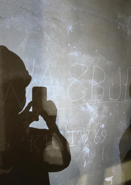 someone takes a picture of ham radio codes carved into walls