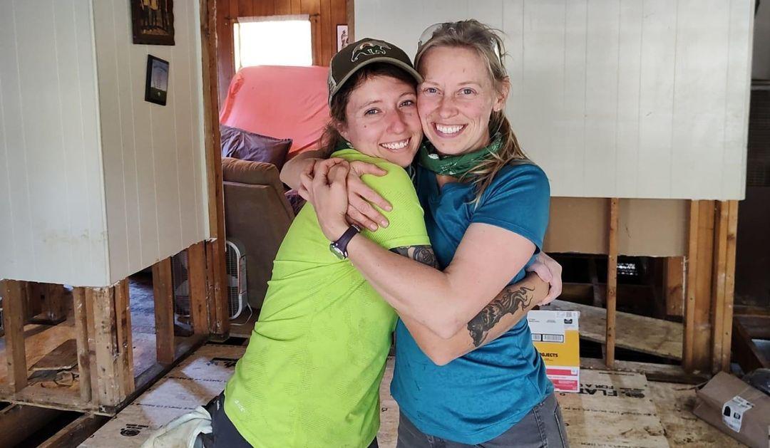 Katie Gregory ’15 and Ashley Kreitz ’15 share a hug while working to restore a home in Barnardsville, North Carolina that was damaged by Hurricane Helene.