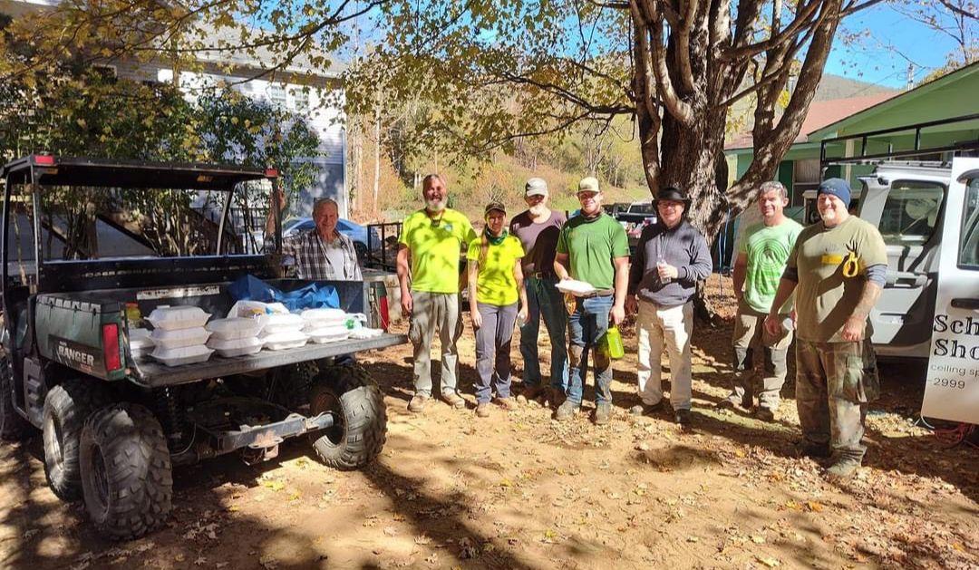 Ashley Kreitz’s volunteer crew taking a break for a meal outside of a home they restored in Barnardsville, North Carolina.