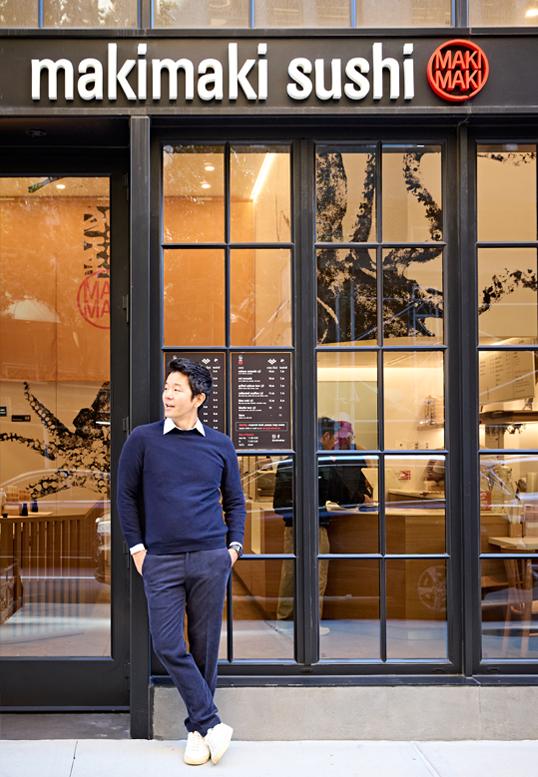 Kevin Takarada ’06G stands outside of one of his four MakiMaki Sushi locations in New York City.