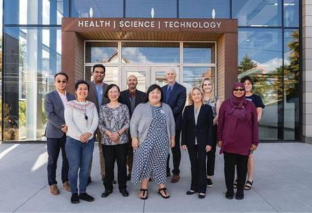 People standing in front of CDAT research center exterior
