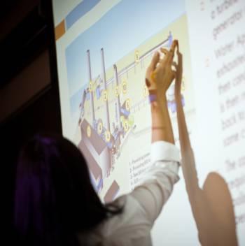 Person using their hand to outline a presentation