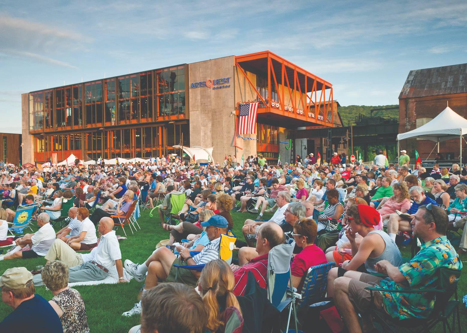 Crowd sitting on the grass
