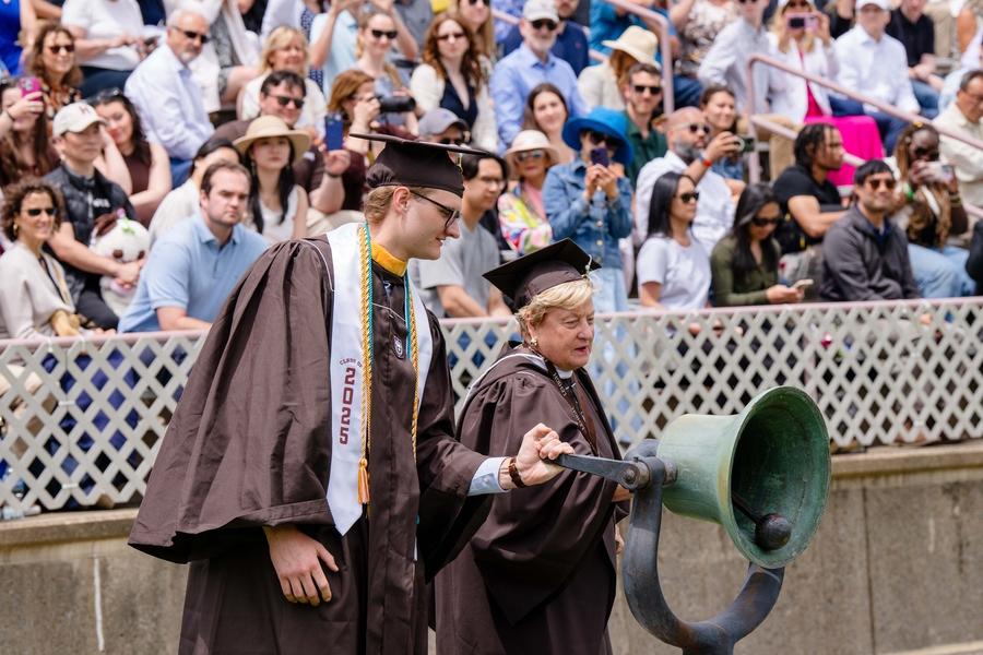 Alumni ringing bell at Commencement