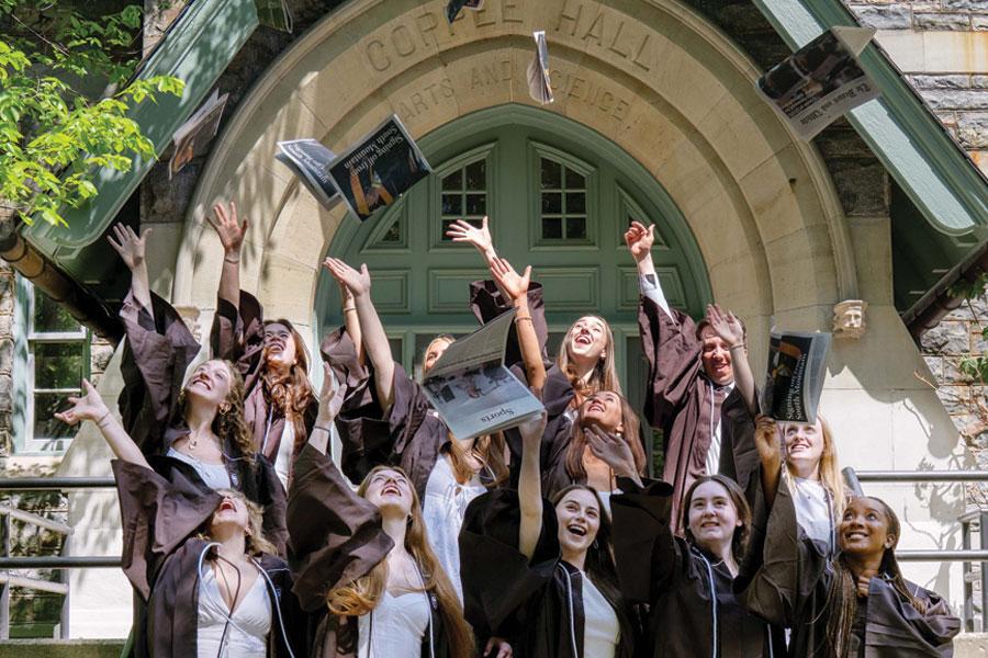 Journalism Grads tossing their caps