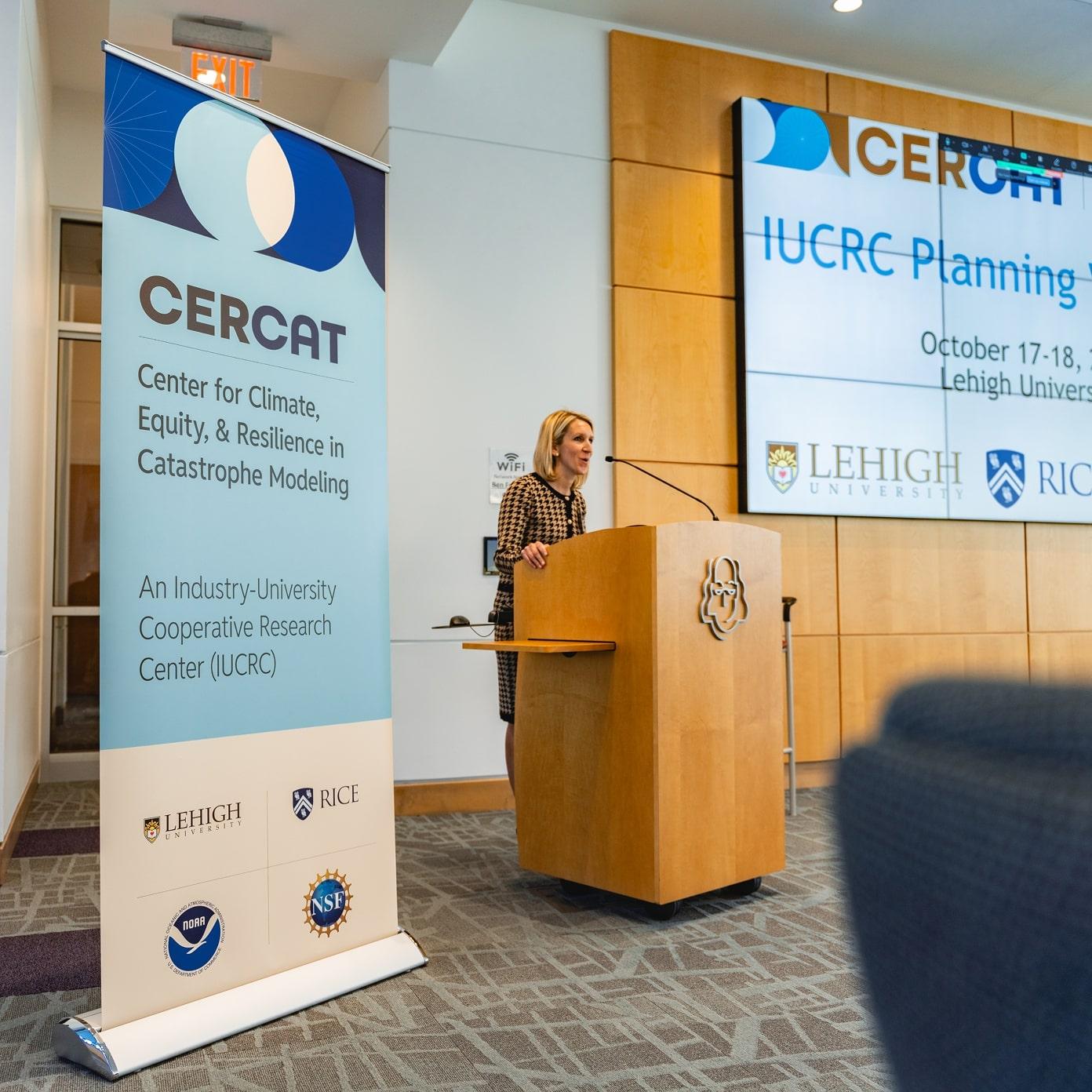 Speaker at a podium giving a presentation