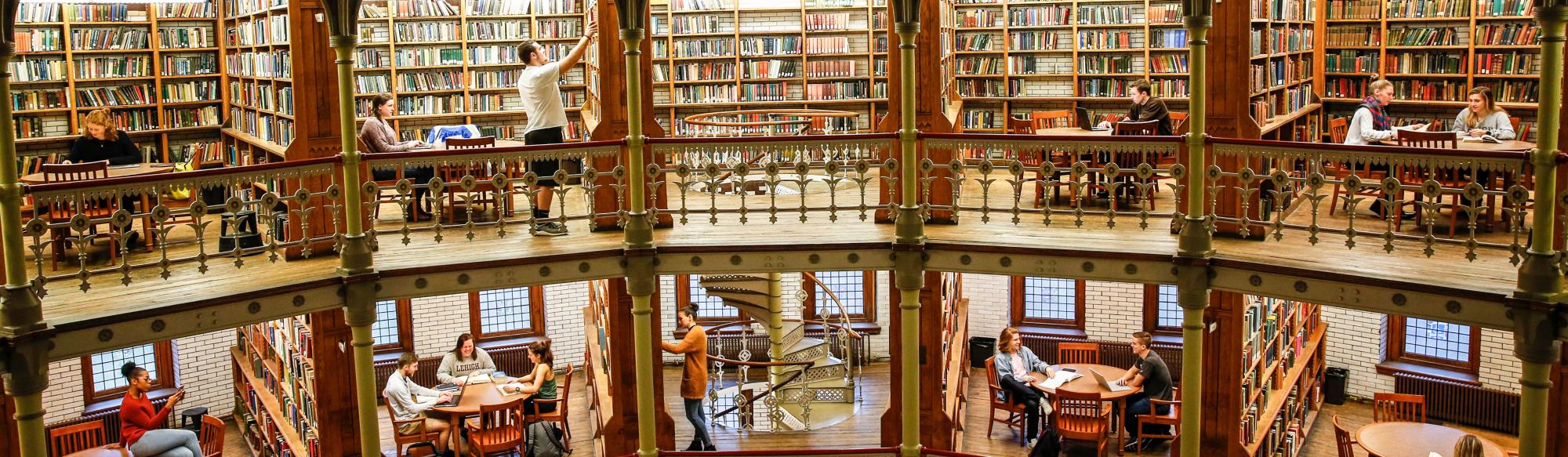 Wide photo of sections of a library