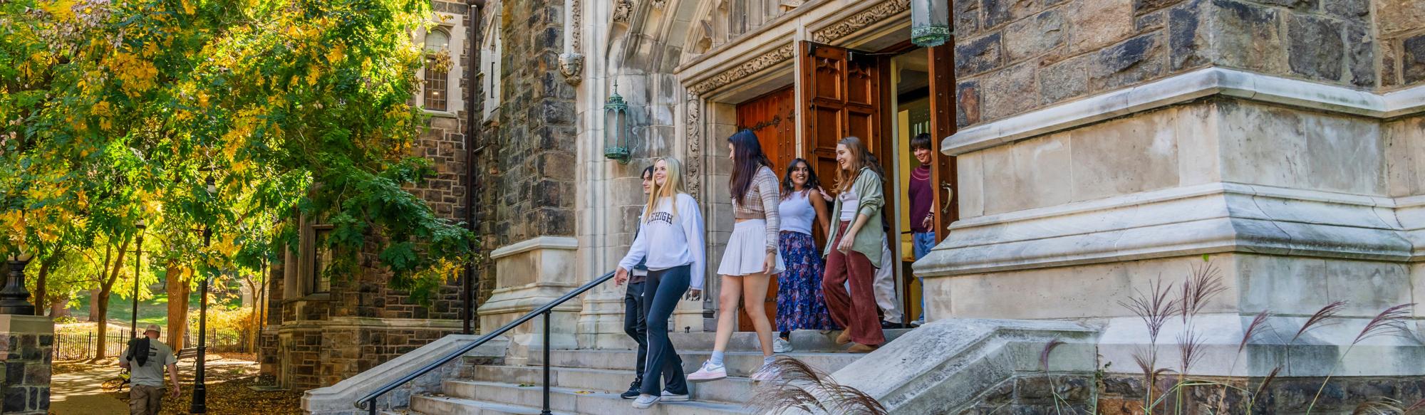 Students walking out of an academic building